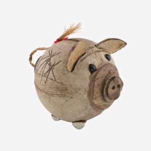 A pig that is sitting on top of a table.