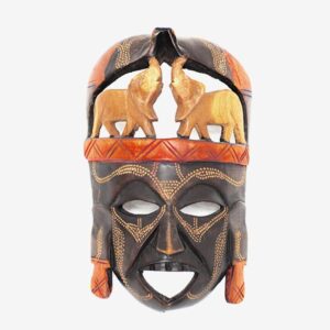 A wooden mask with elephants on it.
