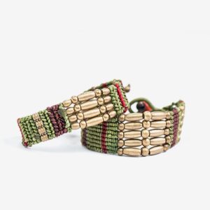 A pair of bracelets made from beads and twine.