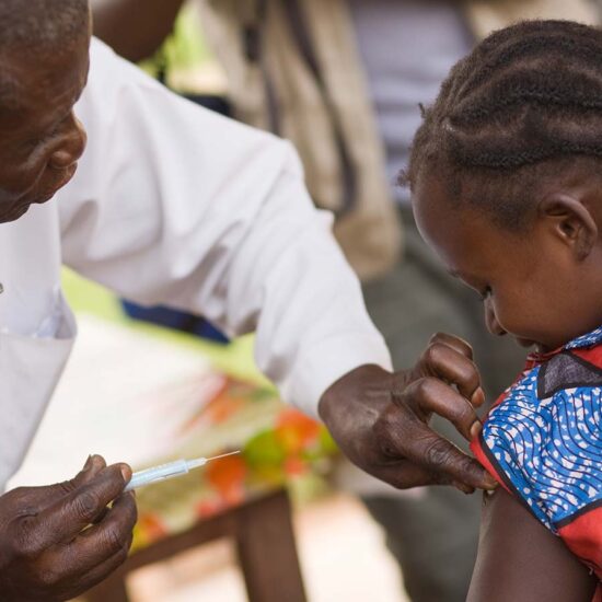 A man and child are examining something.