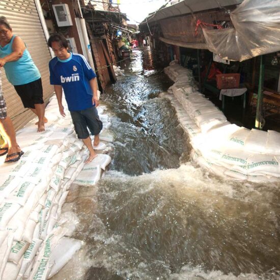 A man walking down the street with people