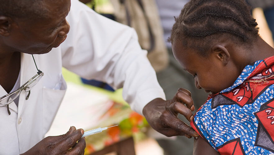 A man and child are looking at each other.