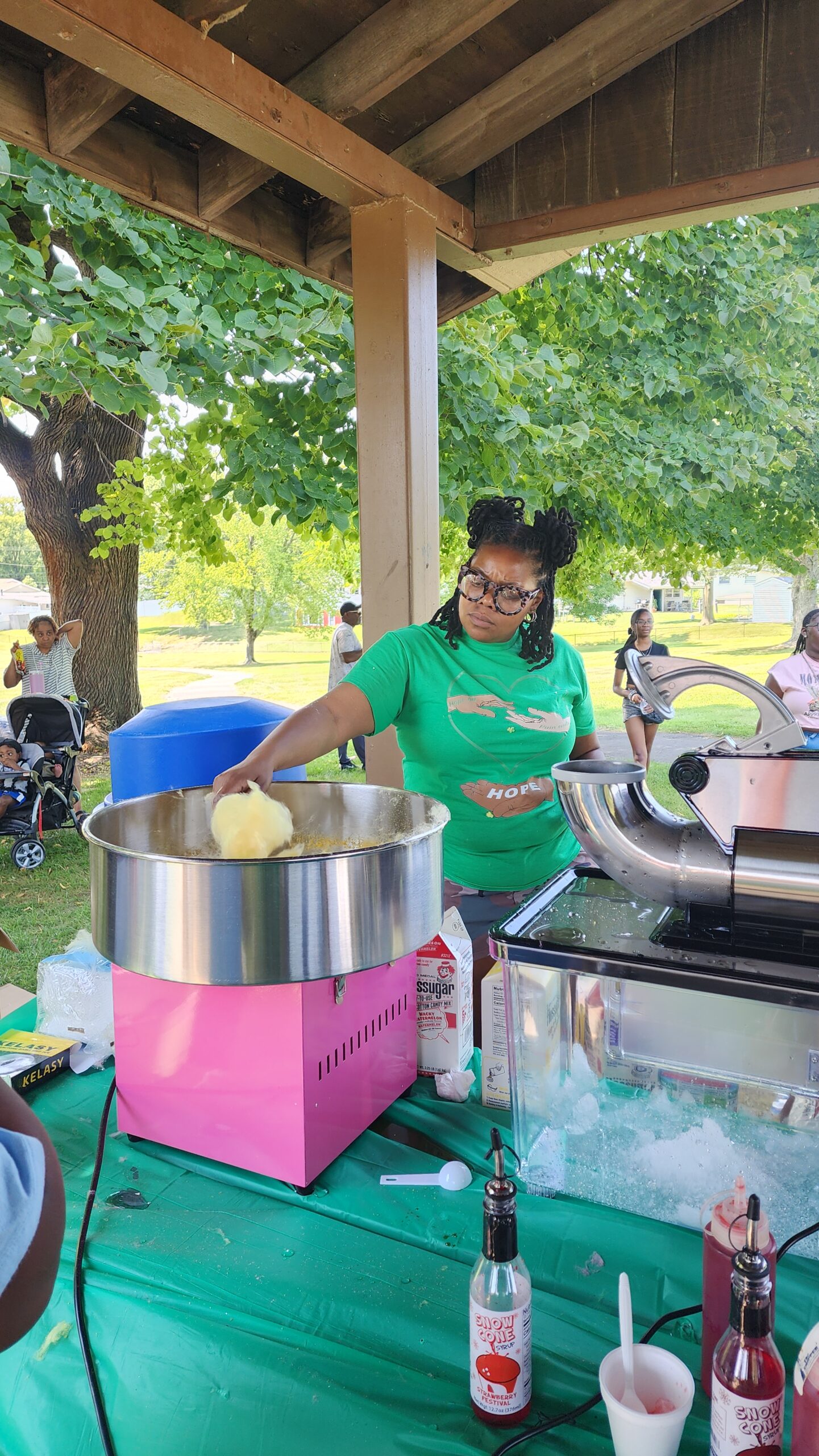 A woman cooking food in a large pot.